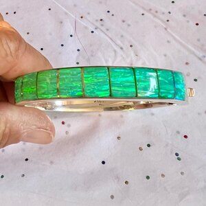 Silver bangle with green opals inlaid